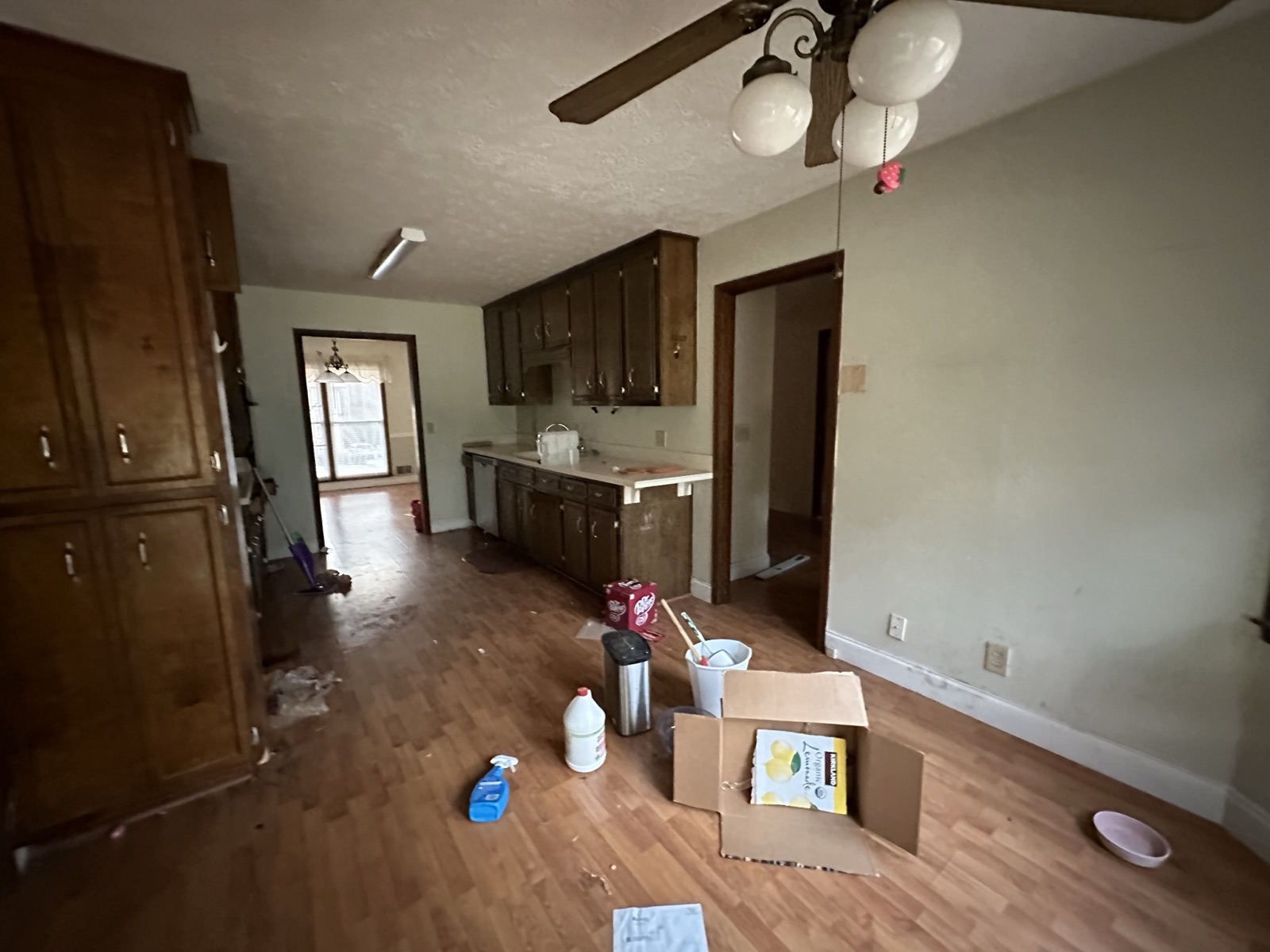Dated kitchen before renovation with original cabinetry and closed layout